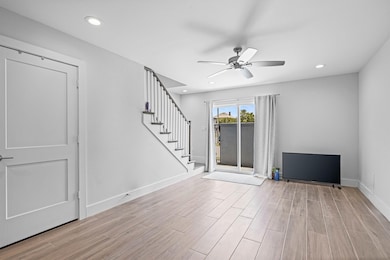 Modern living area with wood-look flooring, recess