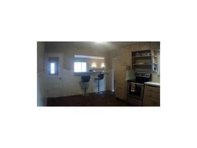 View of breakfast bar from kitchen. SS appliances 