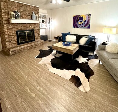 Living room with wood burning fireplace