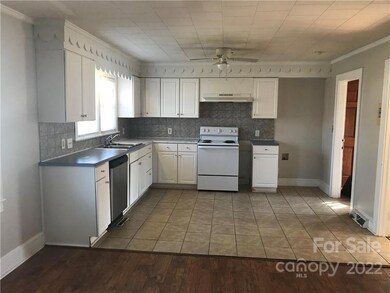 Kitchen with range and dishwasher