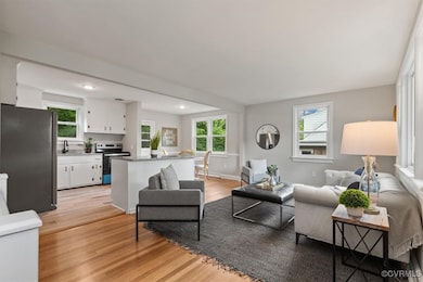 Living area featuring light wood-style flooring an
