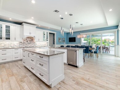 Kitchen with white wood cabinets, light tones of s