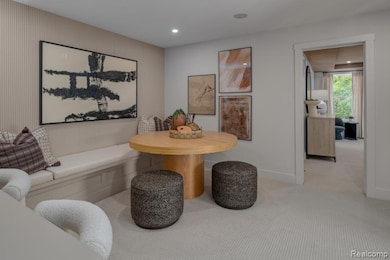 Carpeted dining space with baseboards and recessed lighting