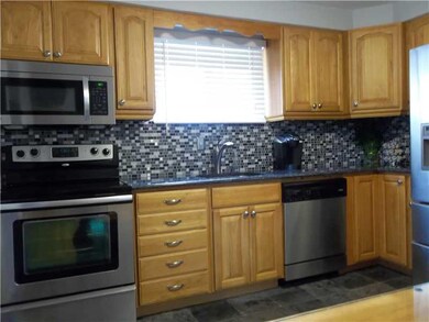 Kitchen. Stainless dishwasher, microwave and elect