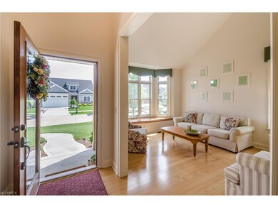 Inviting 2 Story Foyer, Wood Floor, Custom Trim an