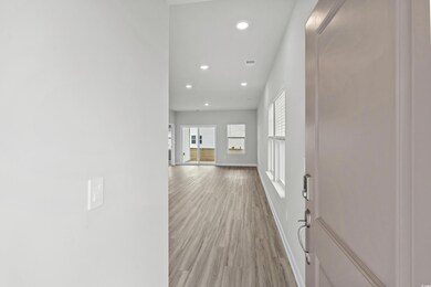 Corridor featuring light hardwood / wood-style flo