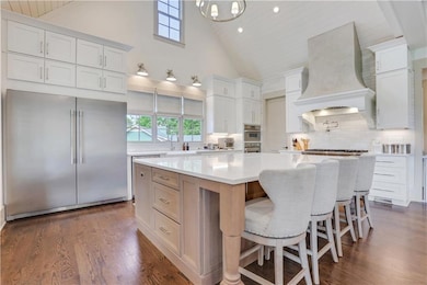 Chef's dream kitchen with vaulted ceiling.