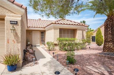 Entrance to property featuring stucco siding and a tile roof