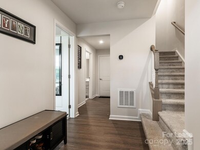 Lower level features guest suite, 2 car garage, and several storage areas.