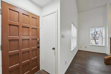 Entrance foyer featuring dark wood-style flooring 
