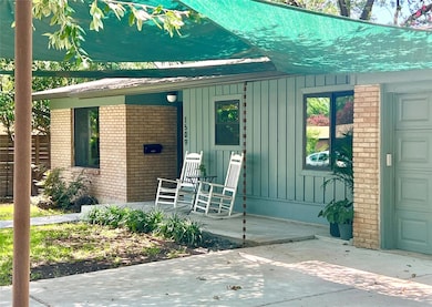Doorway to property featuring board and batten si