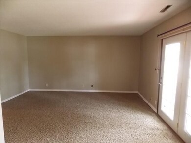 Good size living room with French Doors that lead 