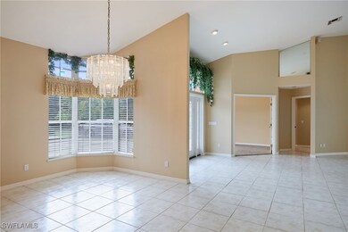 Unfurnished dining area featuring high vaulted cei