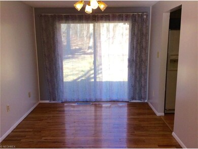 DINING ROOM WITH HARDWOOD FLOORING, CEILING FAN W/