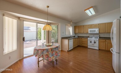 Kitchen opens to family room with access to backyard.