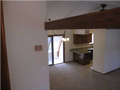 VIEW FROM STAIRS LOOKING DOWN ON DINING ROOM/KITCH