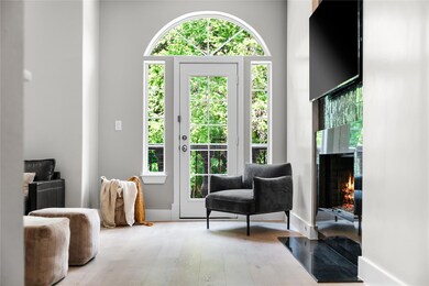 Entryway with wood finished floors, a wealth of n