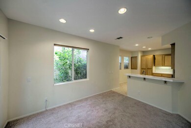 Living room opens up into kitchen.  Lots of natural light.