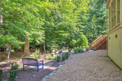 Peaceful rear yard with stone patio & walk-way