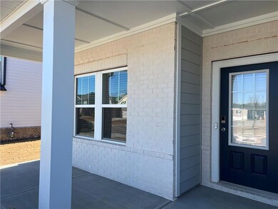 Doorway to property featuring a porch