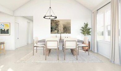 Vaulted dining area with chandelier