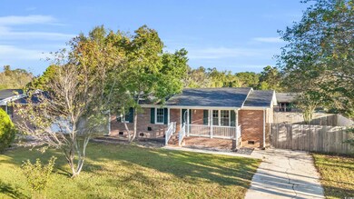 View of front facade with a porch and a front lawn