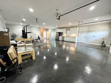 Heated and cooled oversized garage built for 4 cars