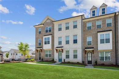 Townhome / multi-family property featuring brick s