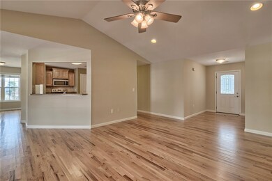 Front foyer into living room.  Opening into kitche