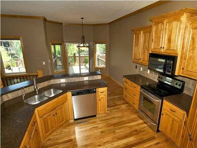 Spacious kitchen with corian counters, stainless a