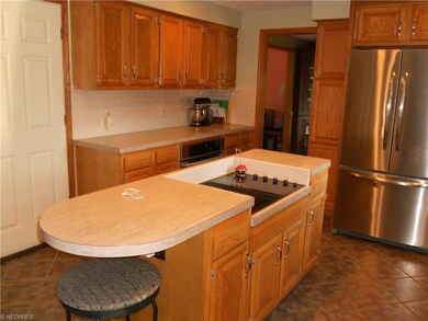 Kitchen has ceramic floors, stainless steel applia