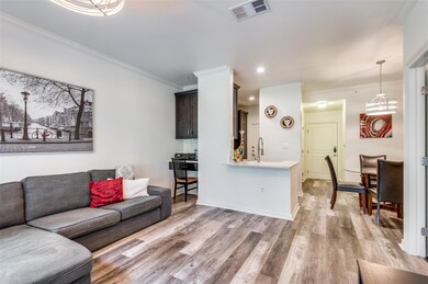 Living room with crown molding and built-in office