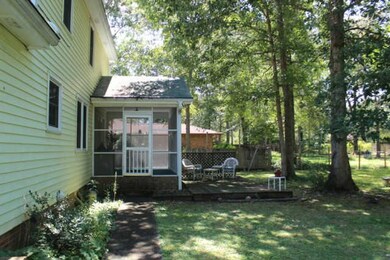 The large backyard has a great screened in porch for entertaining and relaxing