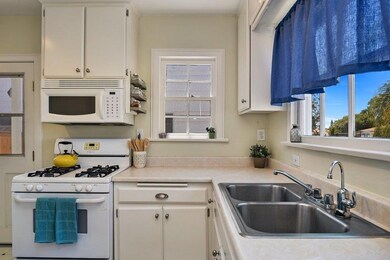 Mostly original kitchen is flooded with natural li