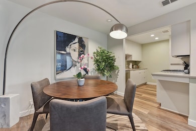 Dining area featuring baseboards, recessed lighti