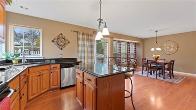 The large kitchen features a kitchen island, grani