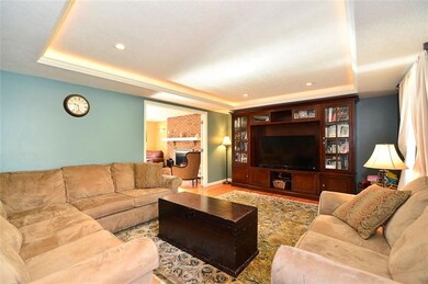 Double French doors connect the Living Room and Fa