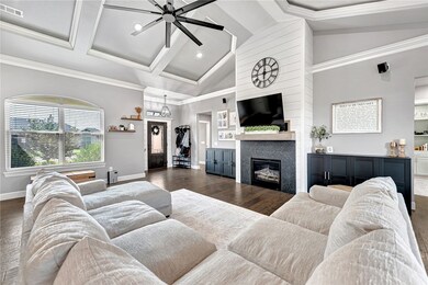 This inviting, wide-open living area welcomes you