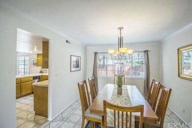 Dining Room leads to kitchen and looks out onto ba