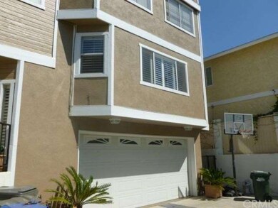 View from entry sidewalk towards garage