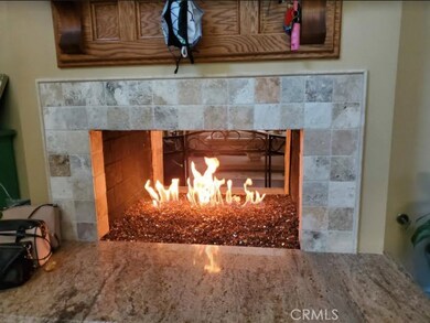 Flow Through Fire Place from Living Room To Open Country Kitchen Area