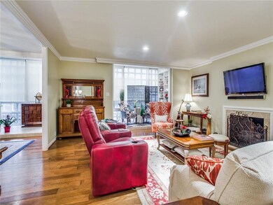 Living area opens to dining room, with wood floori