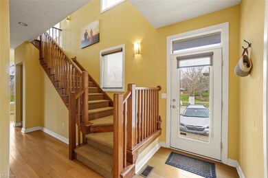 Front entrance with open staircase.