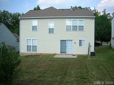 Exterior Back - Stock photo, yard is fenced.