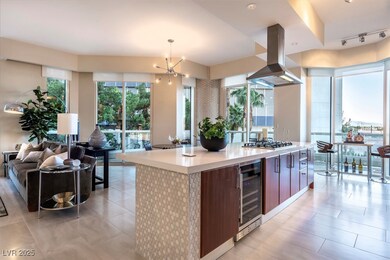 Kitchen featuring wine cooler, island exhaust hood