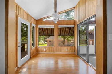 2nd dining area or sun room located between the kitchen and screened in porch with access to the back deck.