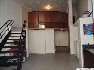 The bedroom area is located behind the beautiful w
