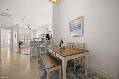 Dining room with baseboards, a ceiling fan, visibl