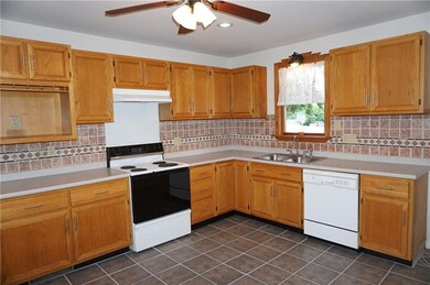 Abundance of countertop space and oak cabinetry fo