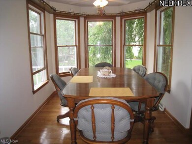 Dinette with hardwood floors.